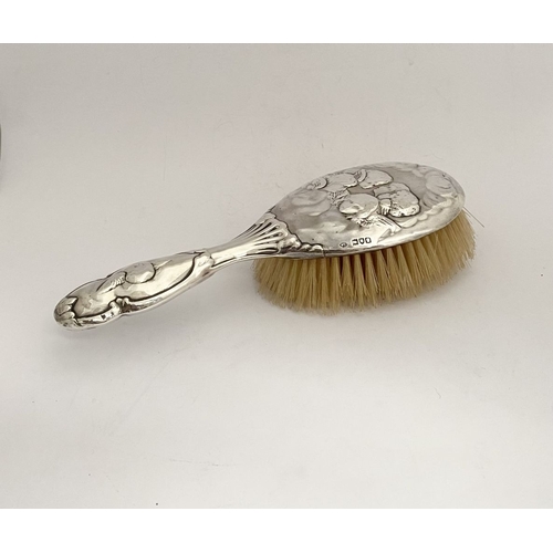 12 - A DECORATIVE EDWARD VII SILVER HAND MIRROR & HAIRBRUSH, by William Comyns & Sons, Manufacturing silv... 