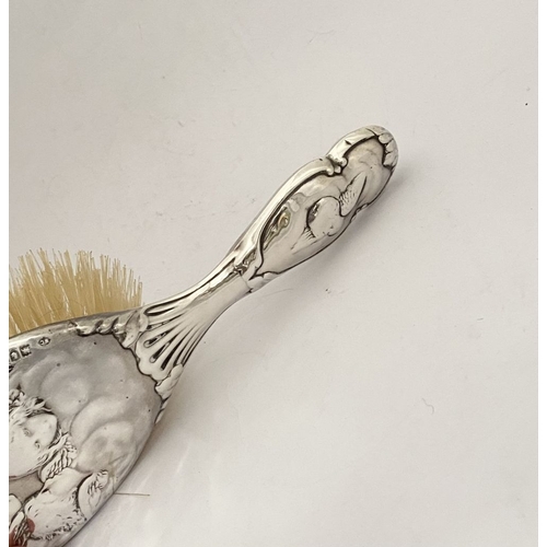 12 - A DECORATIVE EDWARD VII SILVER HAND MIRROR & HAIRBRUSH, by William Comyns & Sons, Manufacturing silv... 