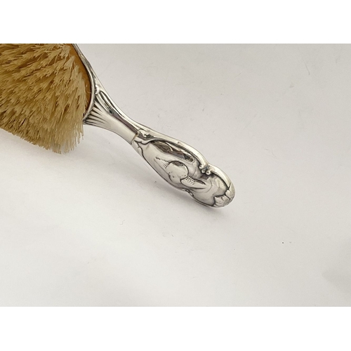 12 - A DECORATIVE EDWARD VII SILVER HAND MIRROR & HAIRBRUSH, by William Comyns & Sons, Manufacturing silv... 