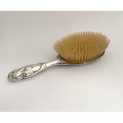 12 - A DECORATIVE EDWARD VII SILVER HAND MIRROR & HAIRBRUSH, by William Comyns & Sons, Manufacturing silv... 