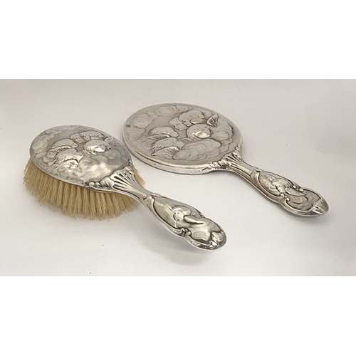 12 - A DECORATIVE EDWARD VII SILVER HAND MIRROR & HAIRBRUSH, by William Comyns & Sons, Manufacturing silv... 