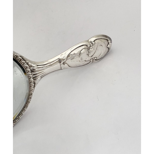 12 - A DECORATIVE EDWARD VII SILVER HAND MIRROR & HAIRBRUSH, by William Comyns & Sons, Manufacturing silv... 