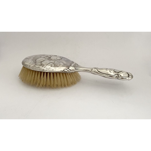 12 - A DECORATIVE EDWARD VII SILVER HAND MIRROR & HAIRBRUSH, by William Comyns & Sons, Manufacturing silv... 