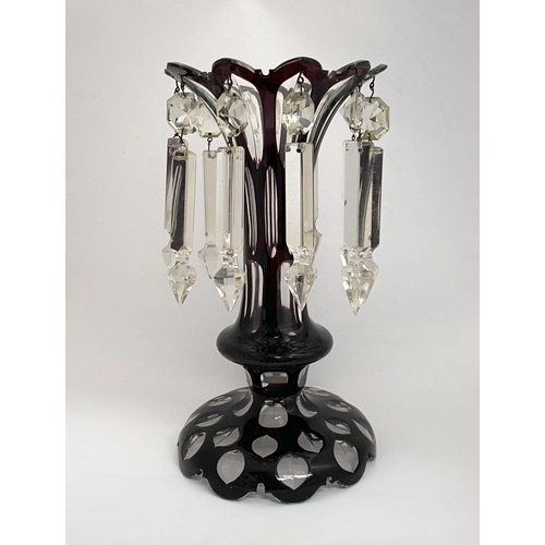 27 - A BEAUTIFUL DEEP RUBY AND CLEAR GLASS LUSTRE, overlaid and cut, with flared rim, tapered stem with k... 