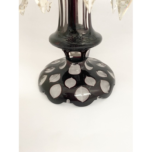 27 - A BEAUTIFUL DEEP RUBY AND CLEAR GLASS LUSTRE, overlaid and cut, with flared rim, tapered stem with k... 