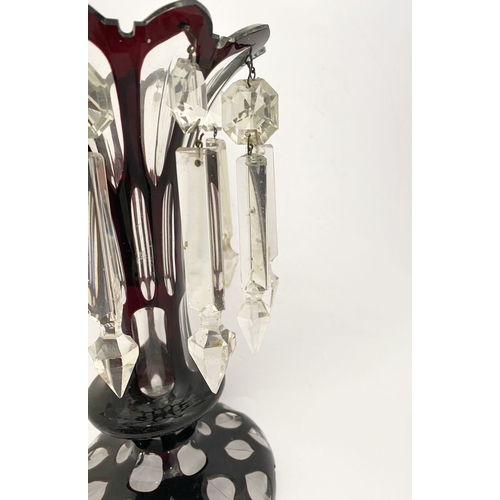 27 - A BEAUTIFUL DEEP RUBY AND CLEAR GLASS LUSTRE, overlaid and cut, with flared rim, tapered stem with k... 