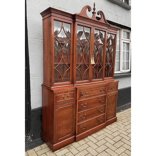 29 - AN EXCELLENT MAHOGANY BREAK FRONT SECRETAIRE BOOKCASE, with swan neck pediment over cornice above fo... 