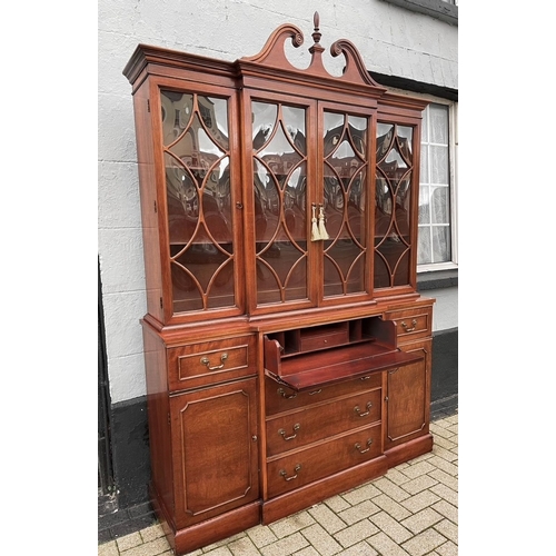 29 - AN EXCELLENT MAHOGANY BREAK FRONT SECRETAIRE BOOKCASE, with swan neck pediment over cornice above fo... 