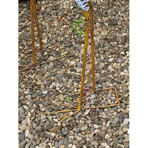 31 - A LARGE PAIR OF PAINTED STEEL GARDEN ORNAMENTS IN THE FORM OF HERONS, dimensions: 98cm high approx.