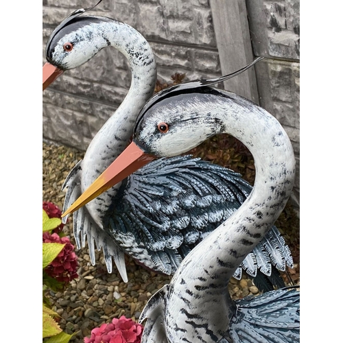 31 - A LARGE PAIR OF PAINTED STEEL GARDEN ORNAMENTS IN THE FORM OF HERONS, dimensions: 98cm high approx.