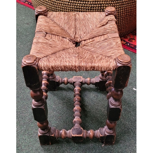 41 - A CHARMING ANTIQUE OAK WOVEN STRAW SEATED STOOL, with turned & square legs united by bobbin & ring t... 