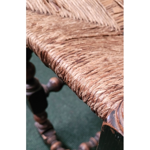 41 - A CHARMING ANTIQUE OAK WOVEN STRAW SEATED STOOL, with turned & square legs united by bobbin & ring t... 