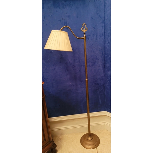 48 - AN EARLY 20TH CENTURY BRASS ADJUSTABLE STANDARD LAMP, with pleated fabric shade, and floor step swit... 