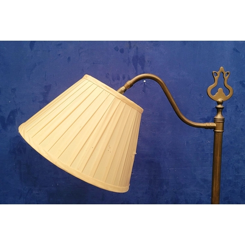 48 - AN EARLY 20TH CENTURY BRASS ADJUSTABLE STANDARD LAMP, with pleated fabric shade, and floor step swit... 