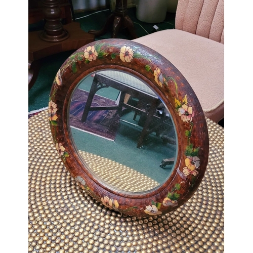 49 - AN UNUSUAL VINTAGE WALL / TABLE TOP MIRROR: the circular bevelled mirror is held in a rounded frame ... 