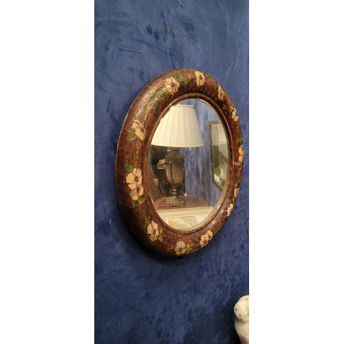 49 - AN UNUSUAL VINTAGE WALL / TABLE TOP MIRROR: the circular bevelled mirror is held in a rounded frame ... 