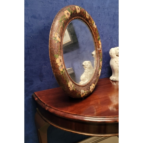 49 - AN UNUSUAL VINTAGE WALL / TABLE TOP MIRROR: the circular bevelled mirror is held in a rounded frame ... 