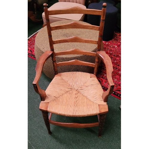 55 - A GEORGIAN STYLE OAK & RUSH LADDER BACK ARMCHAIR, with ring turned uprights to the back and five sha... 