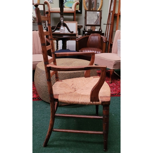 55 - A GEORGIAN STYLE OAK & RUSH LADDER BACK ARMCHAIR, with ring turned uprights to the back and five sha... 