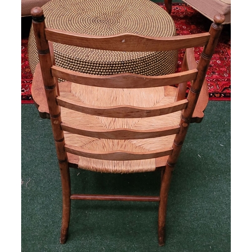 55 - A GEORGIAN STYLE OAK & RUSH LADDER BACK ARMCHAIR, with ring turned uprights to the back and five sha... 