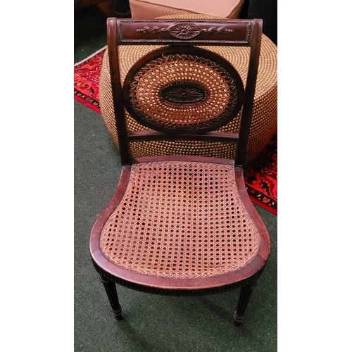 56 - AN EDWARDIAN BERGÉRE MAHOGANY CHAIR, in the Adam style, with carved floral knees & reed detail to th... 