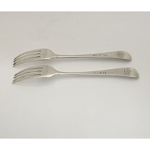 57 - A PAIR OF GEORGE III IRISH SILVER FORKS, by Michael Keating, Dublin c.1794, both hallmarked to under... 