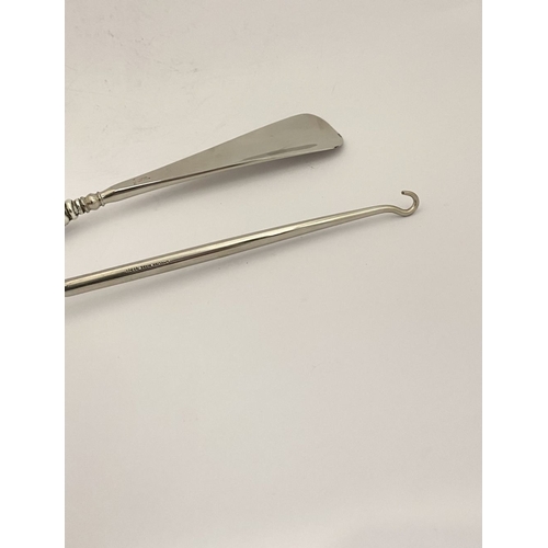 62 - AN EDWARDIAN SILVER SHOEHORN, BUTTON HOOK & CUTICLE PUSHER, the shoe horn and button hook engraved ‘... 