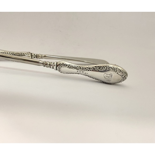 62 - AN EDWARDIAN SILVER SHOEHORN, BUTTON HOOK & CUTICLE PUSHER, the shoe horn and button hook engraved ‘... 