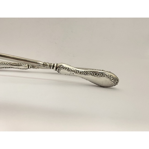 62 - AN EDWARDIAN SILVER SHOEHORN, BUTTON HOOK & CUTICLE PUSHER, the shoe horn and button hook engraved ‘... 