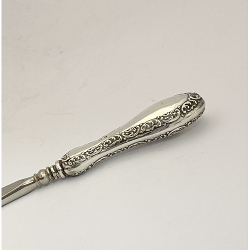 62 - AN EDWARDIAN SILVER SHOEHORN, BUTTON HOOK & CUTICLE PUSHER, the shoe horn and button hook engraved ‘... 