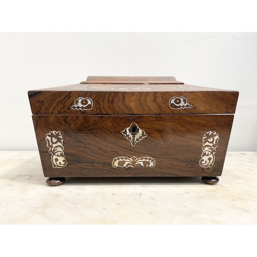 64 - AN EXCELLENT MAHOGANY MOTHER OF PEARL INLAID TEA CADDY BOX, sarcophagus shaped with decorative mothe... 