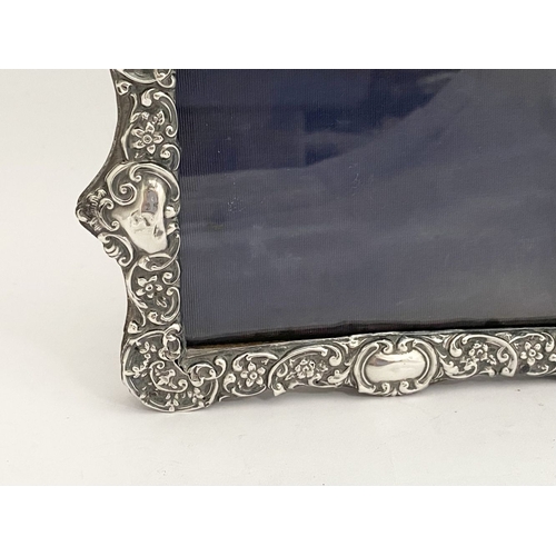 7 - A BEAUTIFUL EDWARD VII SILVER PHOTO FRAME, by Samuel M. Levi, Birmingham c.1900. The frame of rectan... 