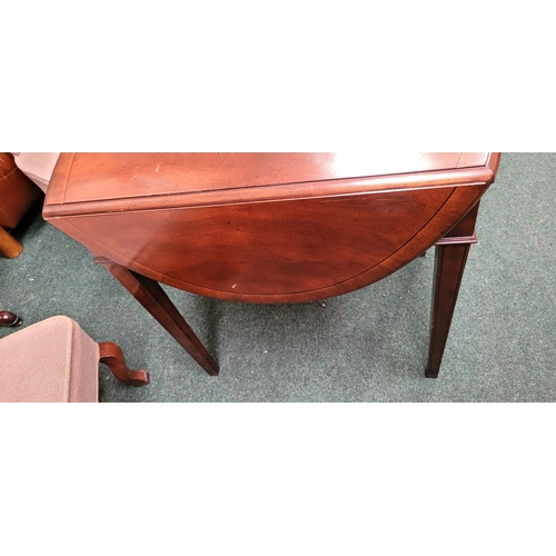 71 - A GOOD QUALITY HEAVY HARDWOOD DROP LEAVE TABLE, with ‘D’ shaped leaves on each side and a single fri... 