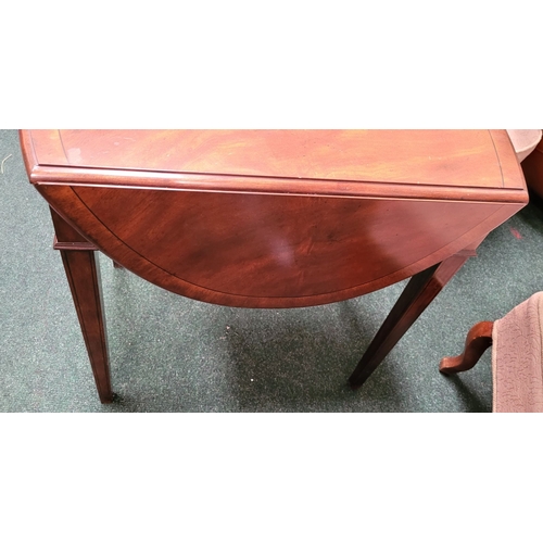 71 - A GOOD QUALITY HEAVY HARDWOOD DROP LEAVE TABLE, with ‘D’ shaped leaves on each side and a single fri... 