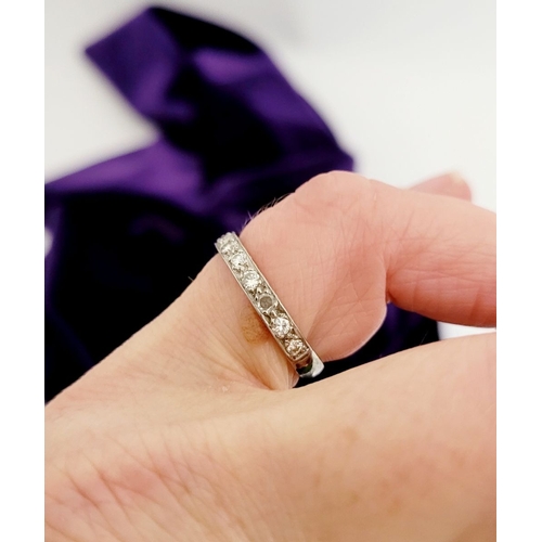 163 - AN 18CT WHITE GOLD HALF ETERNITY DIAMOND RING, a nice classic design, with a row of 11 diamonds set ... 