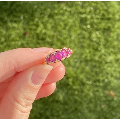 10 - A STRIKING 18CT YELLOW GOLD FIVE STONE RUBY RING, with five oval cut rubies graduating in size from ... 