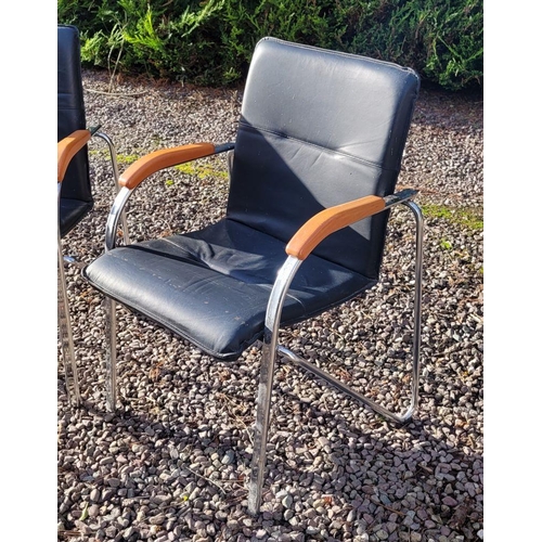 100 - A PAIR OF MODERN LEATHER & CHROME ARM CHAIRS, with curved metal frames & wooden rests to the curve. ... 