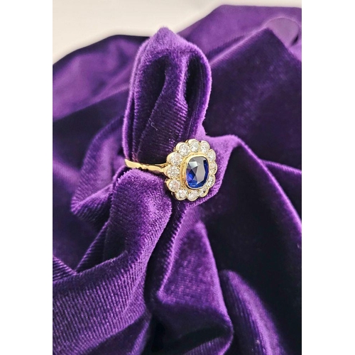 11 - A VERY BEAUTIFUL 18CT YELLOW GOLD SAPPHIRE & DIAMOND CLUSTER RING, the central sapphire is a very go... 