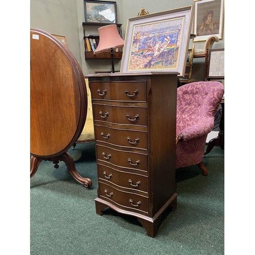 111 - A NEAT SIZED MAHOGANY CHEST OF DRAWERS, serpentine shaped, the top with crossbanded border and mould... 