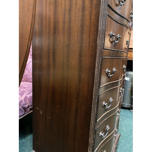 111 - A NEAT SIZED MAHOGANY CHEST OF DRAWERS, serpentine shaped, the top with crossbanded border and mould... 