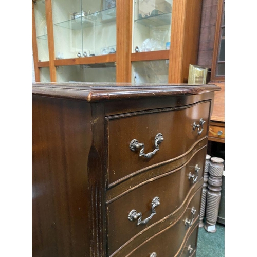 111 - A NEAT SIZED MAHOGANY CHEST OF DRAWERS, serpentine shaped, the top with crossbanded border and mould... 