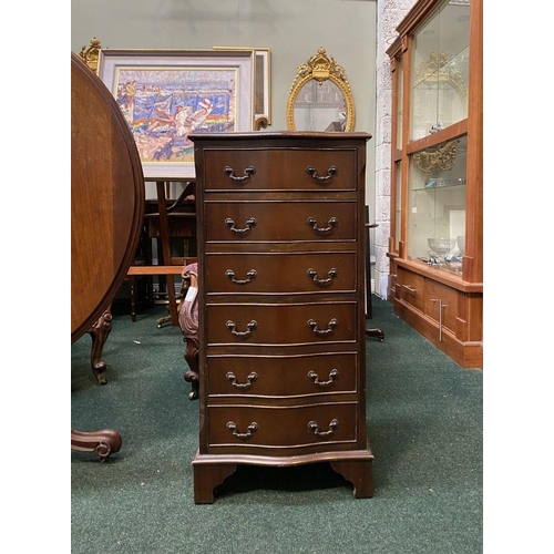 111 - A NEAT SIZED MAHOGANY CHEST OF DRAWERS, serpentine shaped, the top with crossbanded border and mould... 