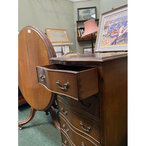 111 - A NEAT SIZED MAHOGANY CHEST OF DRAWERS, serpentine shaped, the top with crossbanded border and mould... 