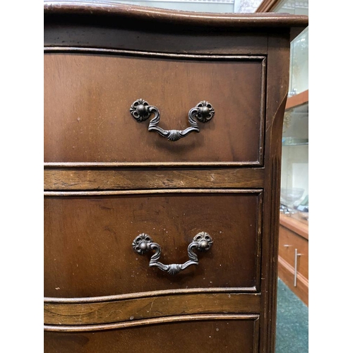 111 - A NEAT SIZED MAHOGANY CHEST OF DRAWERS, serpentine shaped, the top with crossbanded border and mould... 