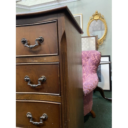 111 - A NEAT SIZED MAHOGANY CHEST OF DRAWERS, serpentine shaped, the top with crossbanded border and mould... 