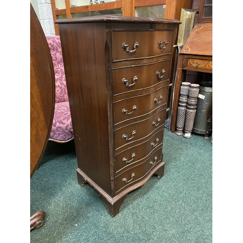 111 - A NEAT SIZED MAHOGANY CHEST OF DRAWERS, serpentine shaped, the top with crossbanded border and mould... 