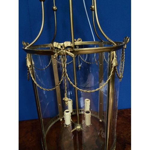 113 - A LARGE BRASS CIRCULAR SHAPED LANTERN, in working order. Finely decorated with glass panels surround... 