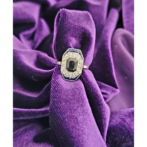 115 - A LOVELY VINTAGE ART DECO SAPPHIRE & DIAMOND CLUSTER RING, with an octagonal shaped central sapphire... 