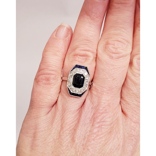 115 - A LOVELY VINTAGE ART DECO SAPPHIRE & DIAMOND CLUSTER RING, with an octagonal shaped central sapphire... 