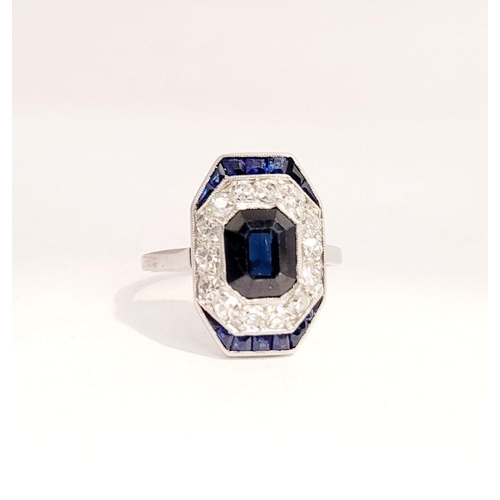 115 - A LOVELY VINTAGE ART DECO SAPPHIRE & DIAMOND CLUSTER RING, with an octagonal shaped central sapphire... 